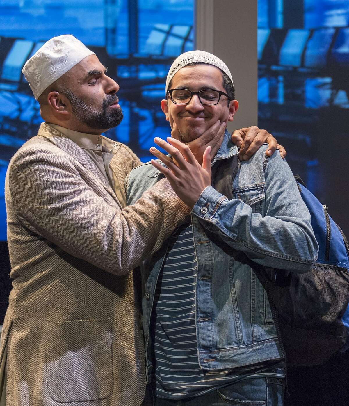 Mosque leader Sheikh Alfani (Munaf Alsafi, left) embarrasses his�son Hani (Salim Razawi)�in Golden Thread Productions' "Our Enemies: Lively Scenes of Love and Combat."