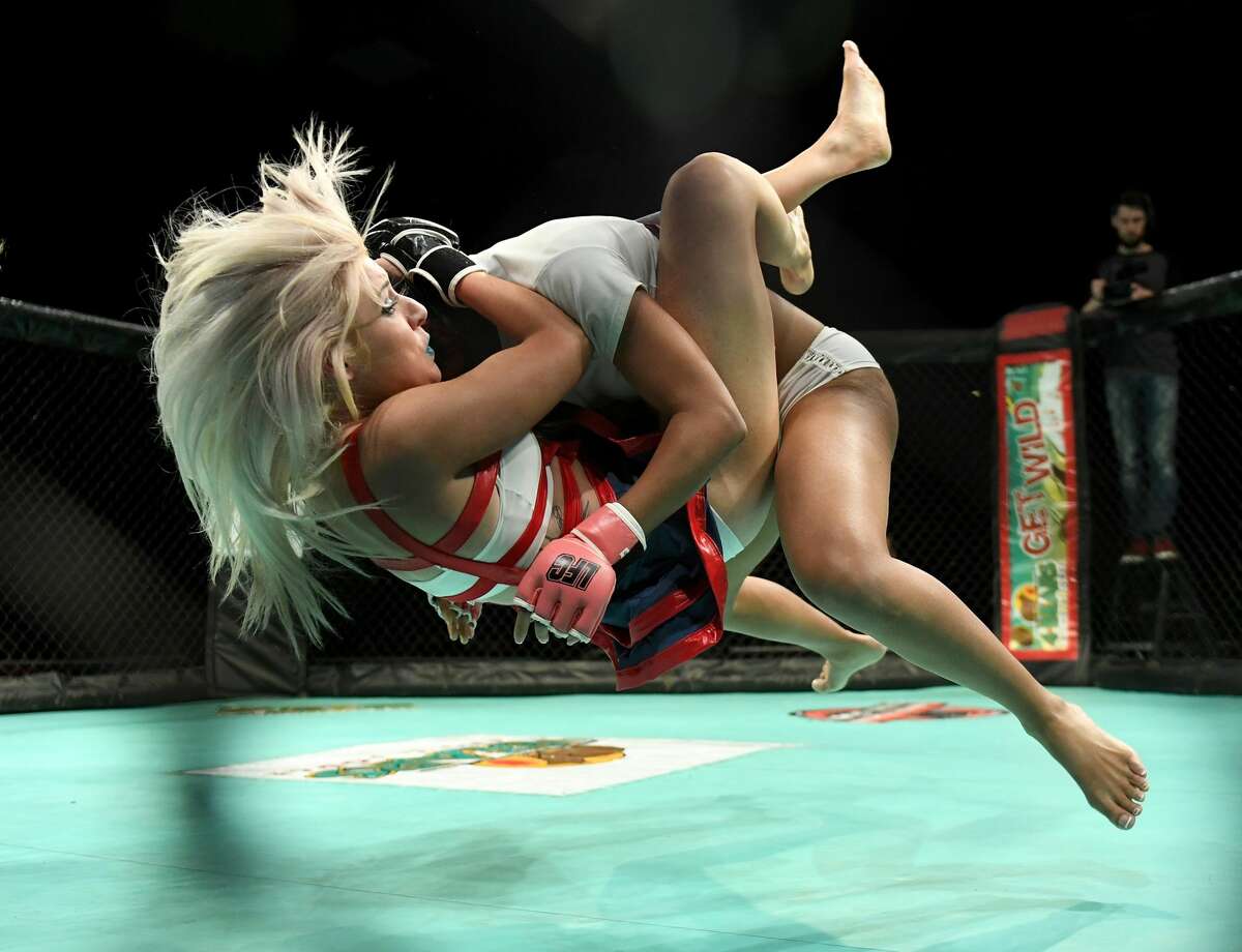 NEW TOWN, ND - OCTOBER 29: Fighters Raya "Sugar Ray" Ryans (L) and Roxy "Roundhouse" Michaels compete during "Lingerie Fighting Championships 22: Costume Brawl I" at 4 Bears Casino & Lodge on October 29, 2016 in New Town, North Dakota. Michaels won the bout. (Photo by Ethan Miller/Getty Images for LFC)