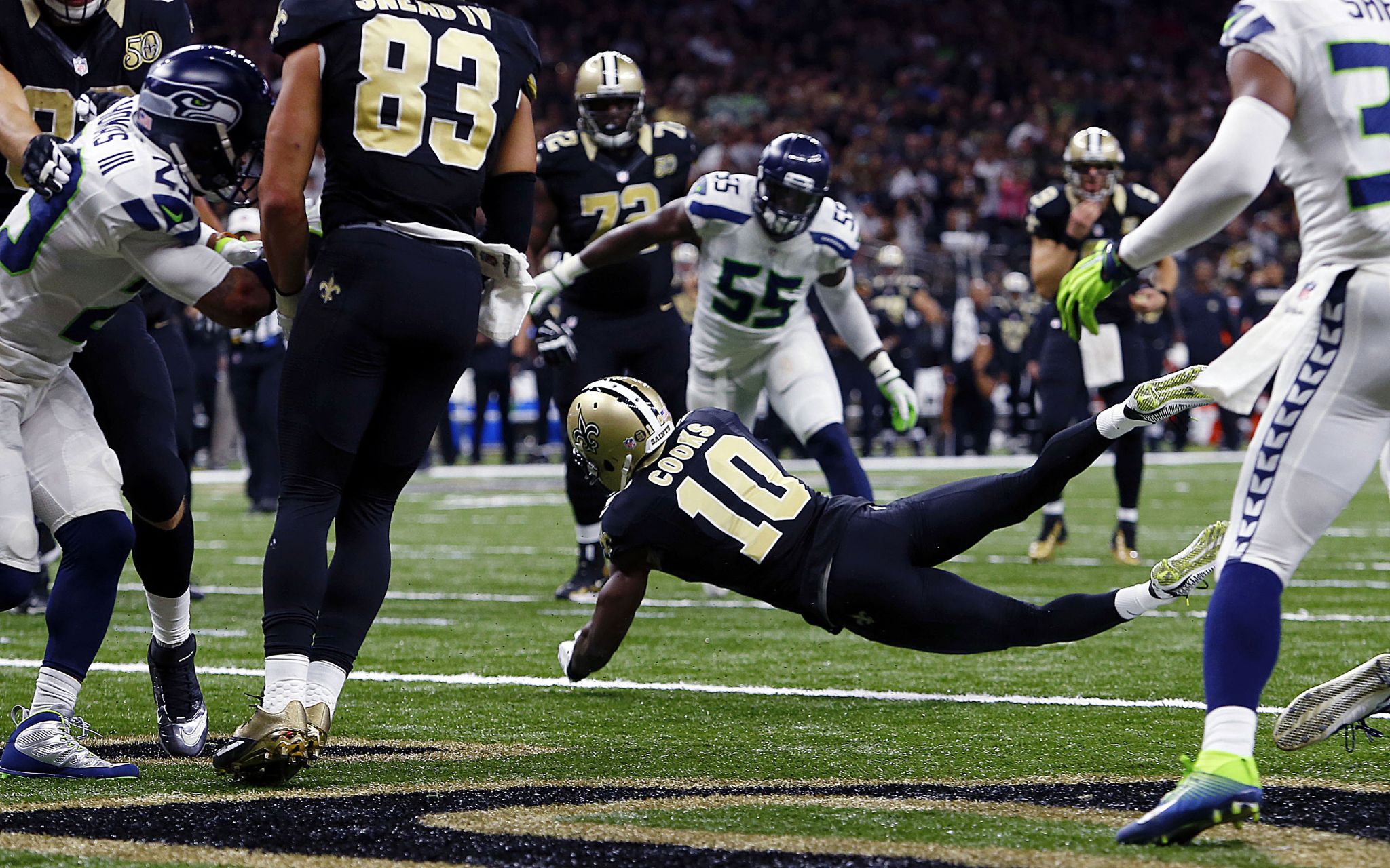 Seattle Seahawks tight end Nick Vannett (81) is stopped by New Orleans  Saints cornerback De'Vante Harris (21) in the second half of an NFL  football game in New Orleans, Sunday, Oct. 30