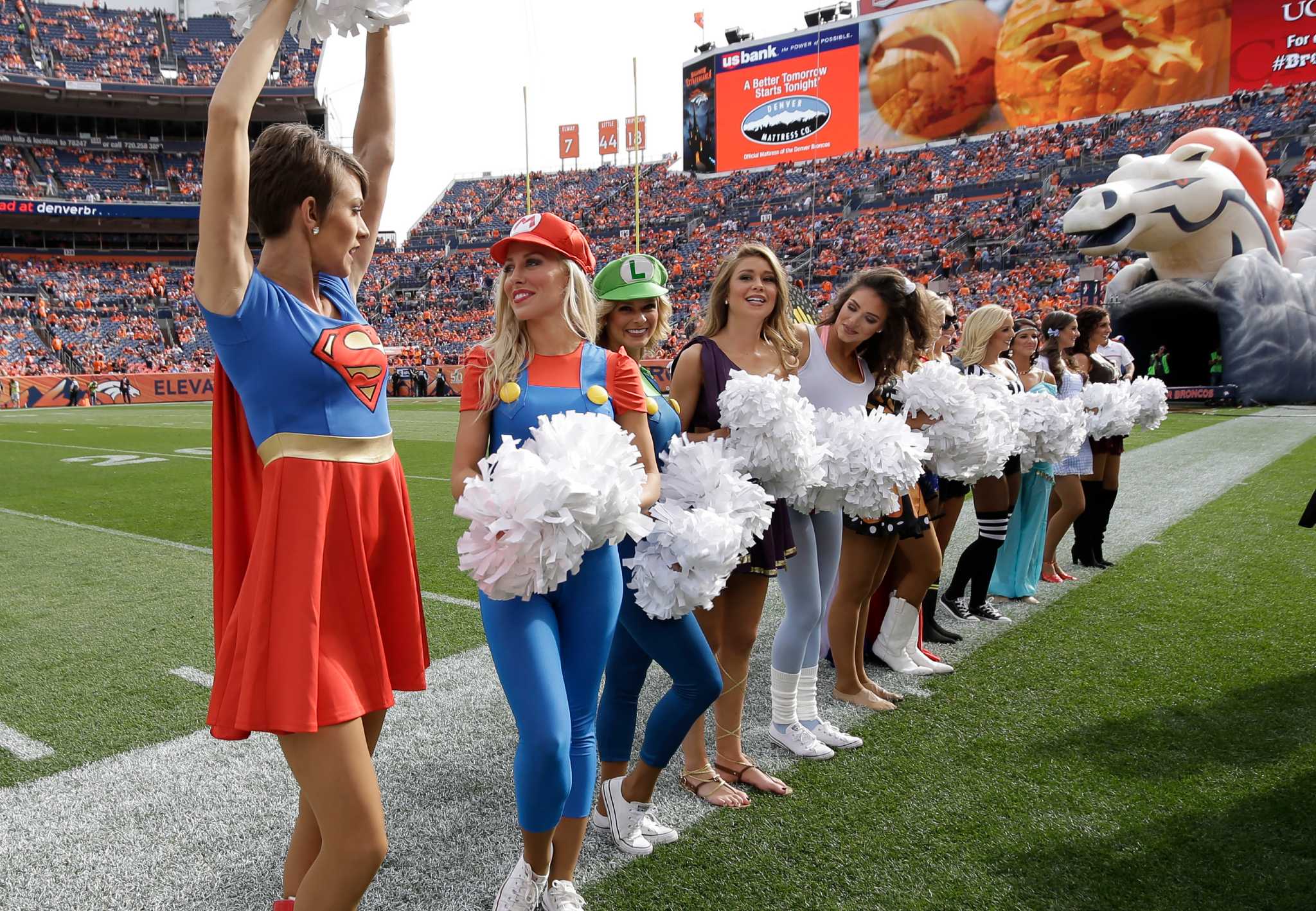 Broncos Cheerleader Dresses Up As Dinosaur For Halloween - CBS