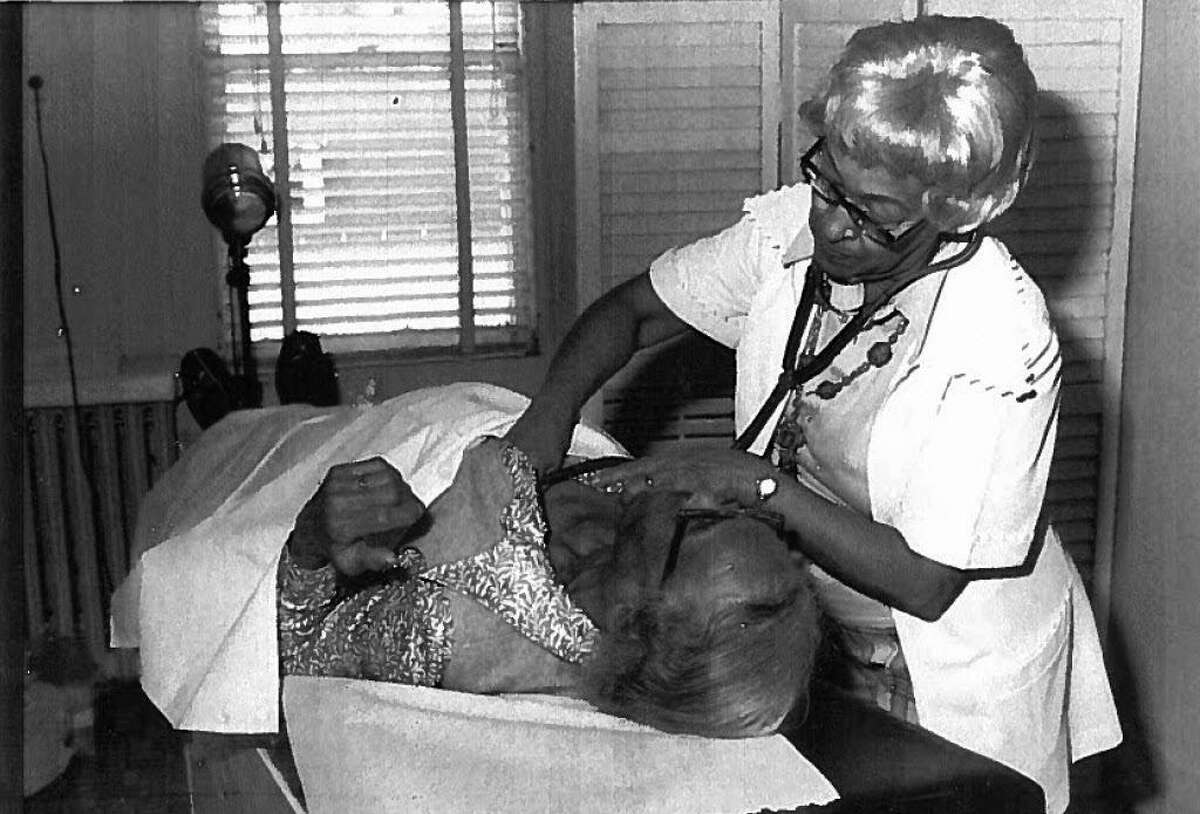 Dr. Joyce Yerwood, Fairfield County's first black female doctor, tends to a patient in her office in Stamford, Conn.