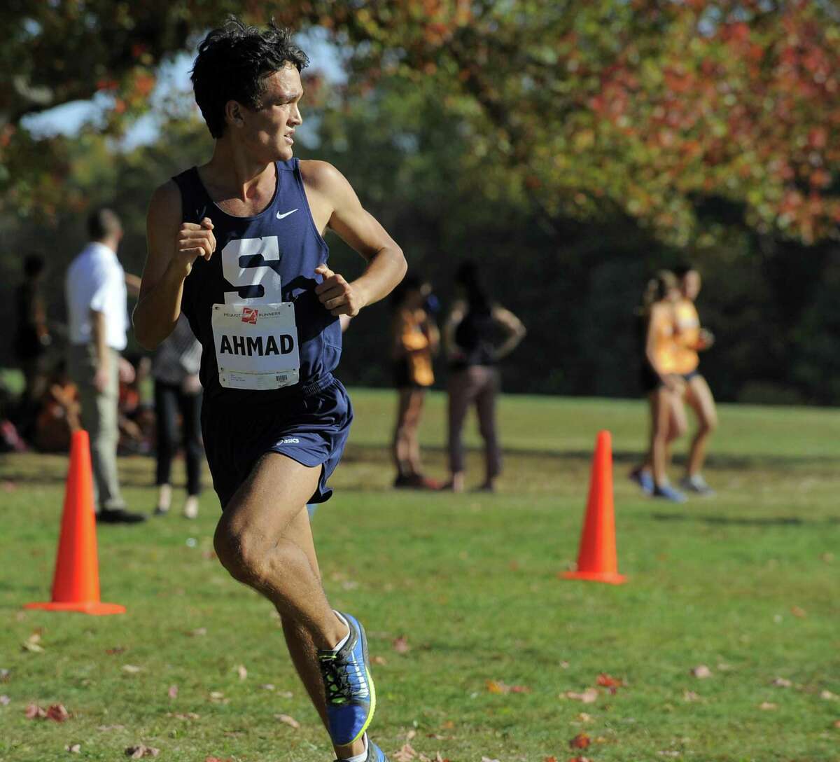 Staples Zakeer Ahmad looks back at the field of competitors on his way to a 1st place finish in the FCIAC Boys Cross Country Championship at Waveny Park in New Canaan, Conn. on Wednesday, Oct. 19 2016. Ahmad finished with a time of 15:49.42.