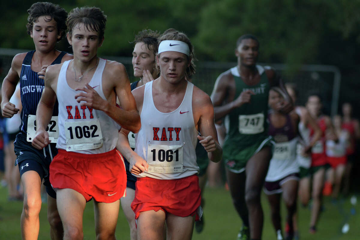 Katy's Cameron Colvin (1062) runs ahead of teammate Garvin Chilton (1061) as they compete during the Varsity Boys 4800 Meter Run at the Andy Wells Invitational at Kingwood High School on Sept. 17, 2016. (Photo by Jerry Baker/Freelance)