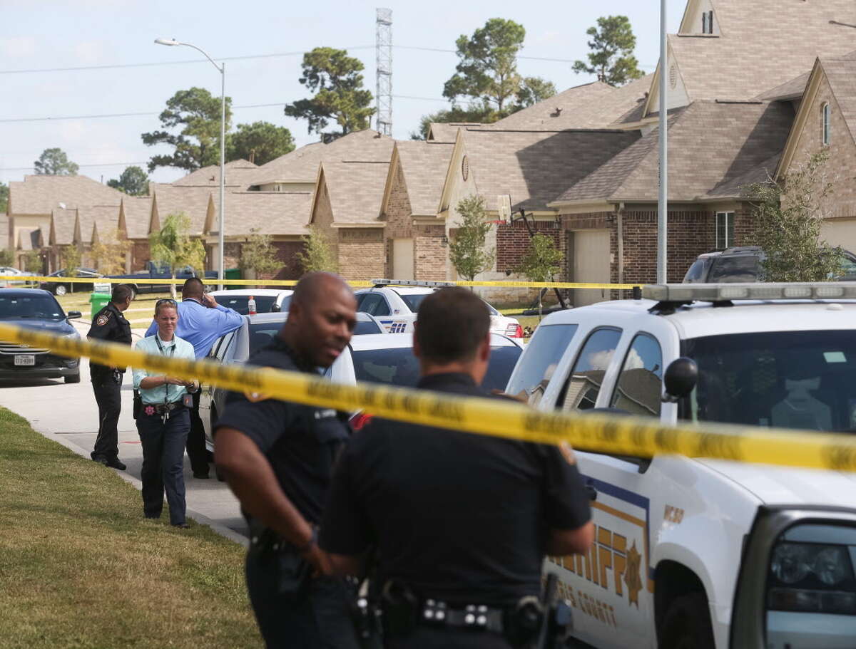 Authorities investigate a homicide in which a woman was killed, at 10410 Fire Sage Dr., Monday, Oct. 31, 2016, in Humble.