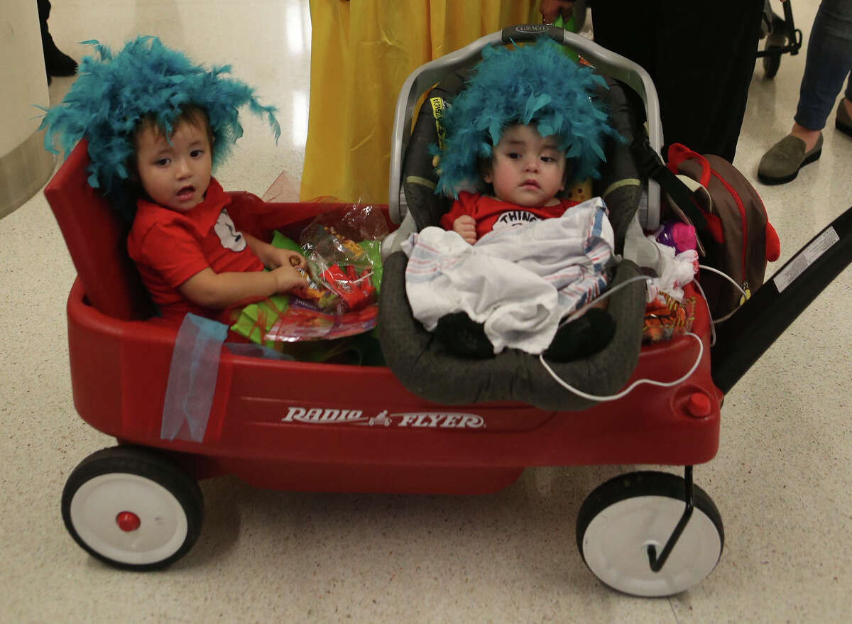 Jasmine Flores (left) and Jayden Resendez (right) take part Monday October 31, 2016 in the Annual Halloween Parade at University Hospital. The event gave patients, parents as well as staff a chance to wear costumes and collect candy a treats in the hospital lobby. Dozens participated whether they were walking, in wheelchairs or in wagons. The pair was being pulled by Jayden's mom Marissa Resendez.