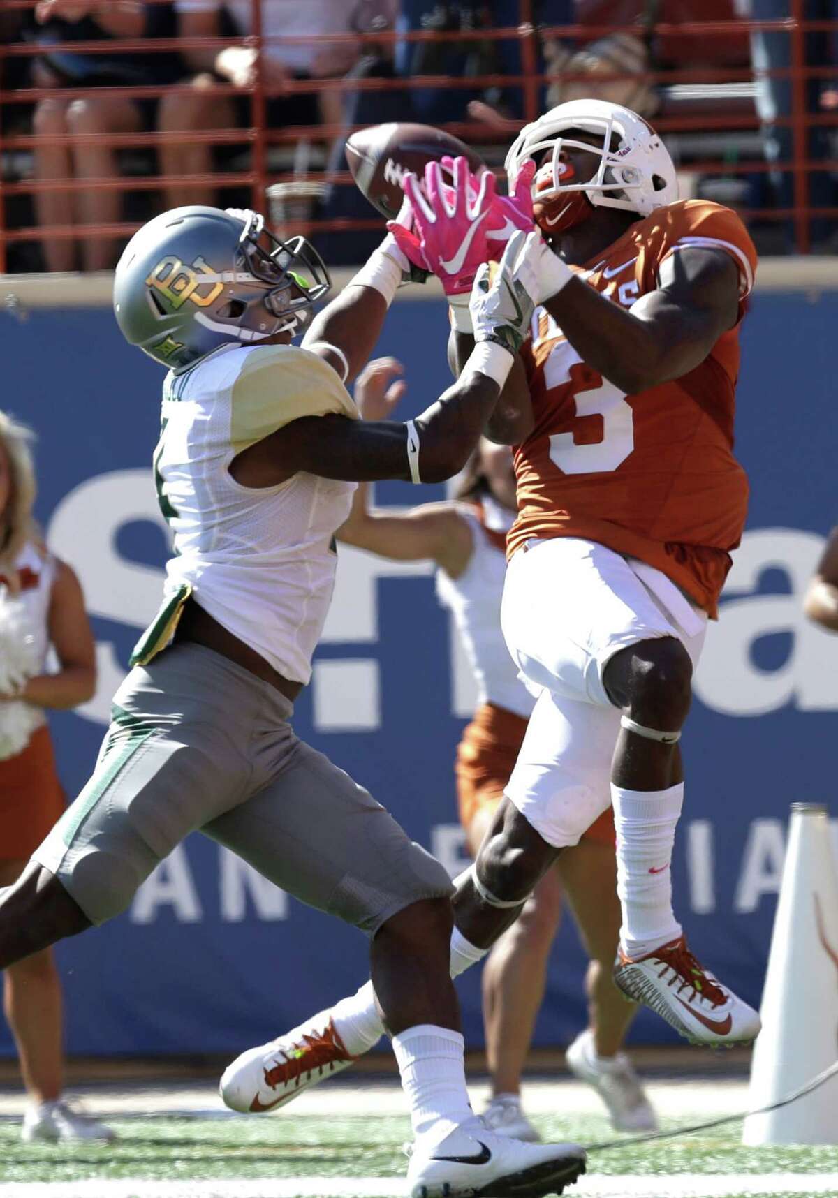 Texas wide receiver Armanti Foreman (3) makes a 40-yard catch over Baylor cornerback Grayland Arnold (4) during the first half on a NCAA college football game, Saturday, Oct. 29, 2016, in Austin, Texas. (AP Photo/Eric Gay)