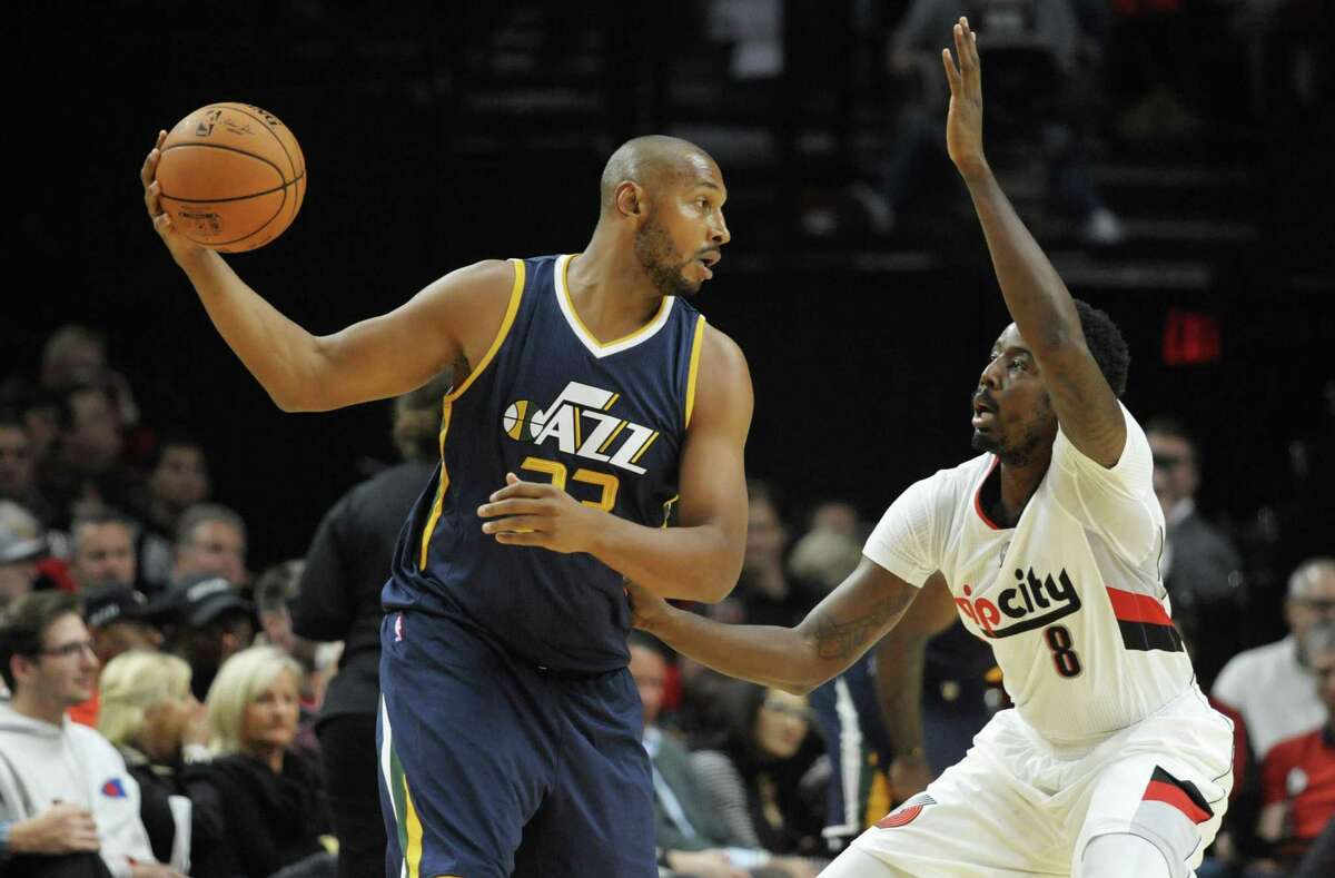 Boris Diaw of the Utah Jazz looks to drive on Al-Farouq Aminu of the Trail Blazers in the first quarter at the Moda Center on Sept. 25, 2016 in Portland.