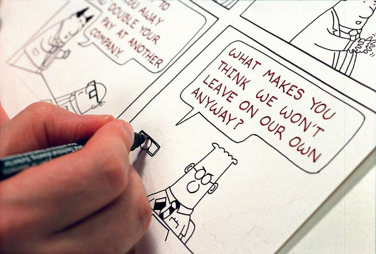 In this file photo, cartoonist Scott Adams works on a Dilbert comic strip in his Blackhawk home.