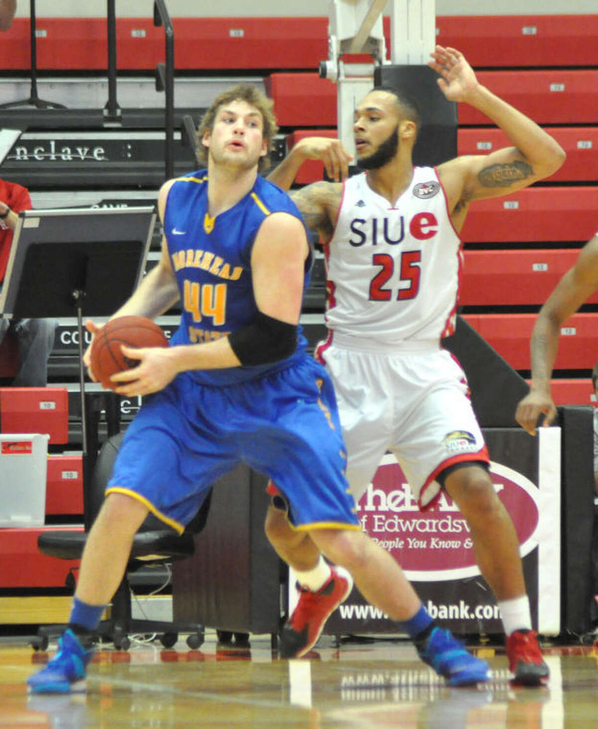 SIUE’s Ray Lester (25) defends Morehead State’s Chad Posthumus (44) during the second half Thursday at the V.C. 