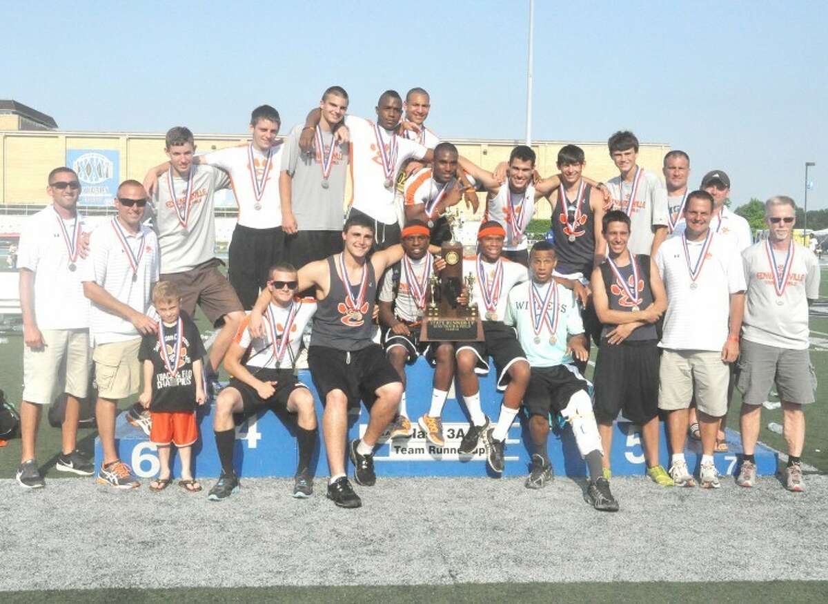 The EHS boys’ track and field team shows off their Class 3A second place trophy at Eastern Illinois University on May 26.
