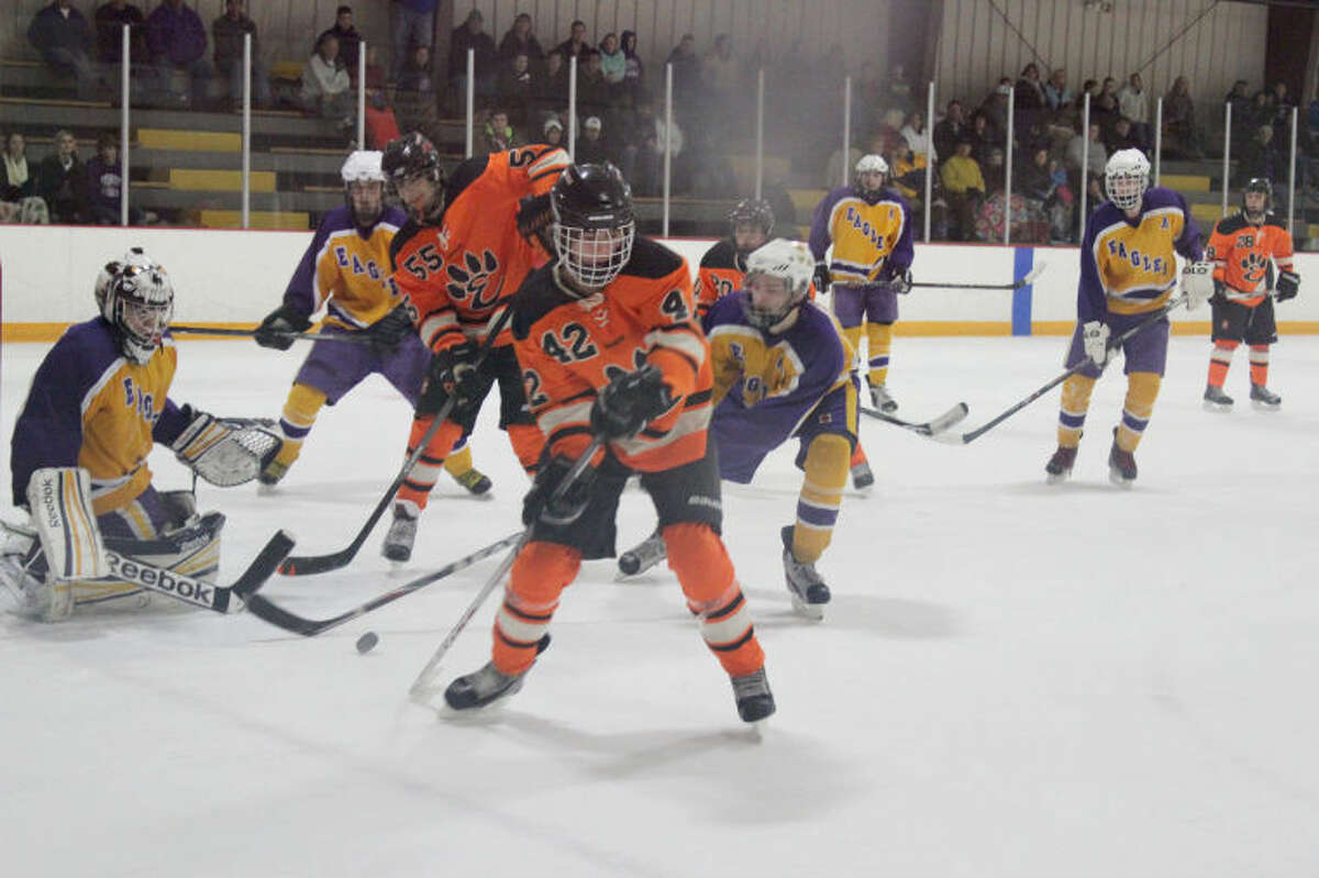 Jake Aurelio (42) and Shaun Raftery (55) look for a scoring opportunity in front of the Bethalto net.