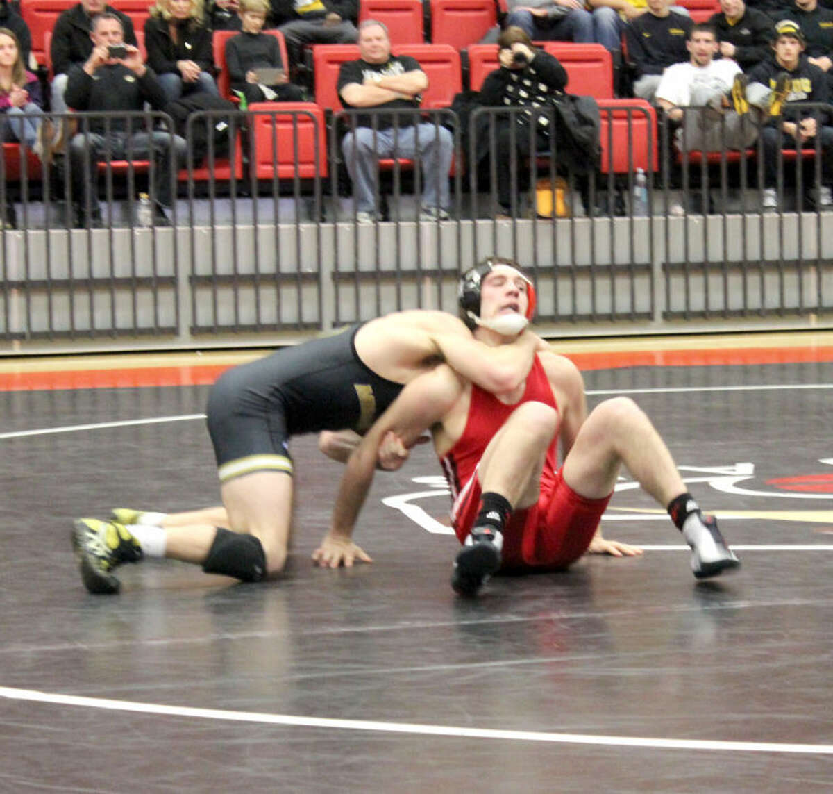 SIUE’s Karsten Van Velsor tries to get out of a hold during his 149-pound match against Missouri’s Blake Pepper.
