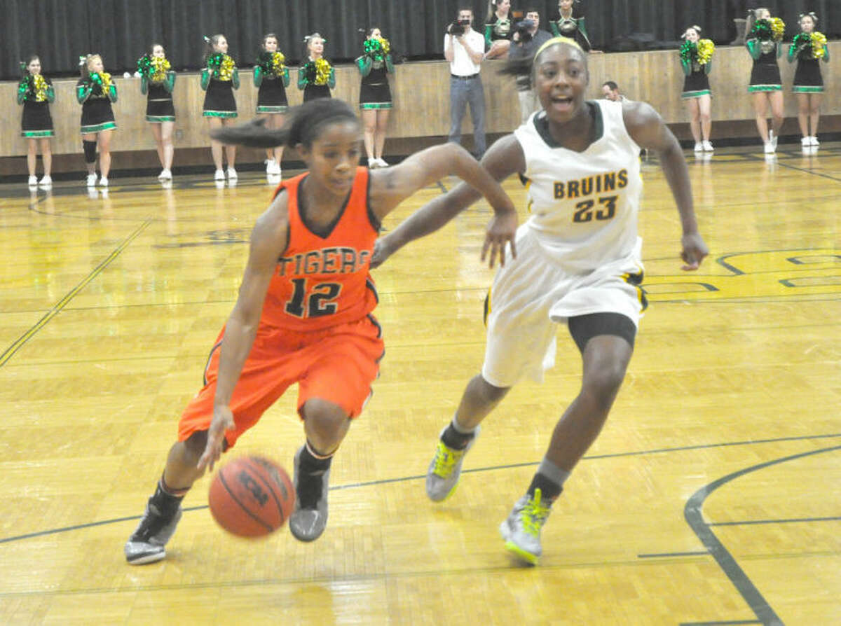 Edwardsville’s Lauren White drives to the basket on Friday vs. the Rock Bridge Bruins in Columbia, Mo.