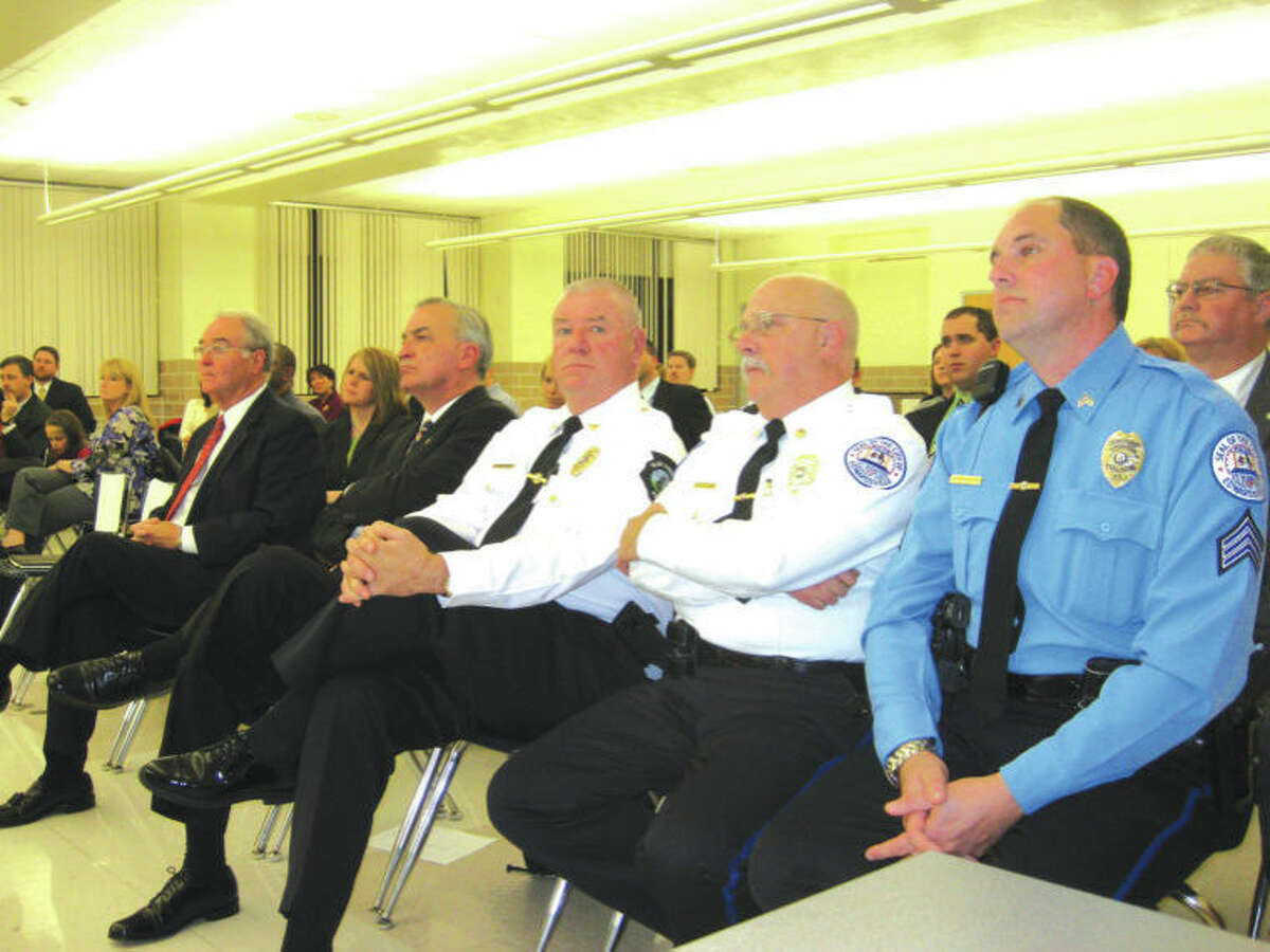Law enforcement officials attending Monday's Edwardsville District 7 Board of Education meeting are, from left: retired U.S. Secret Service agent Jack Fox; Madison County Sheriff Bob Hertz, Glen Carbon Police Chief John Lakin, acting Edwardsville Police Chief Don Lask and District 7 School Resource Officer and School Safety Officer Sgt. Charlie Kohlberg.