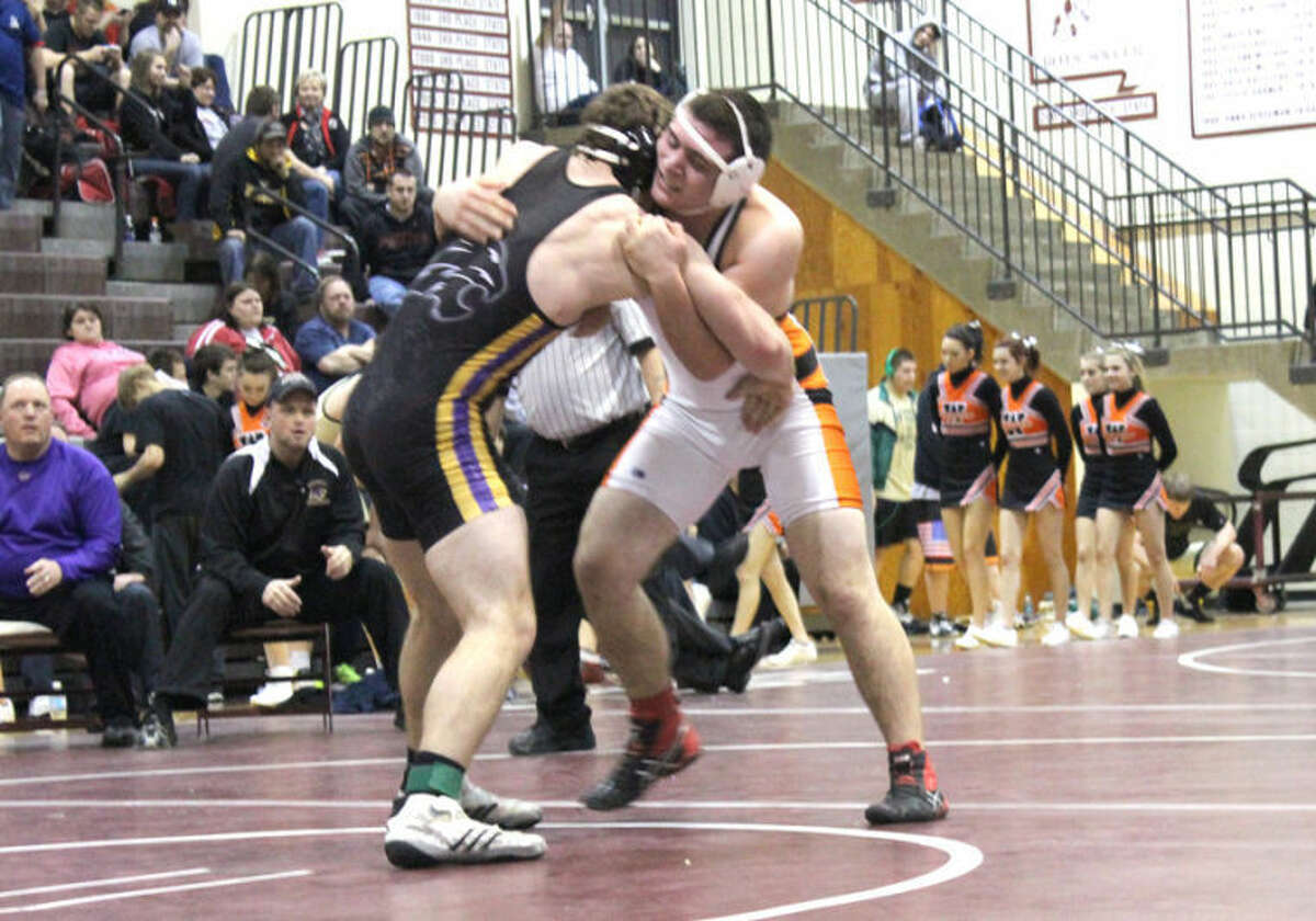 EHS’ Zach Ufert locks up with Eureka’s Mitchell McCain in the title match at 195 pounds on Saturday at St. Charles West High School.  