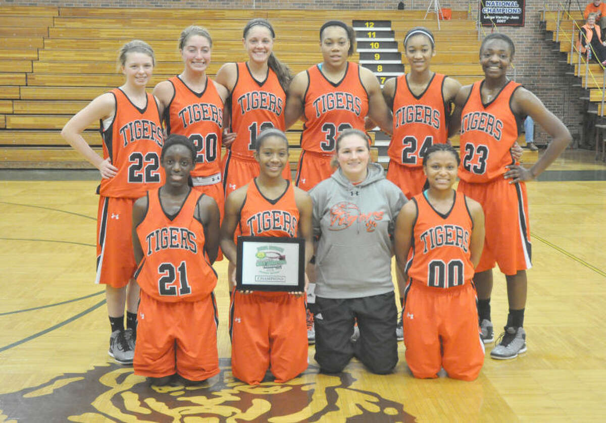 The EHS girls' basketball team poses with the first-place plaque from the Rock Bridge (Mo.) Tournament on Saturday.