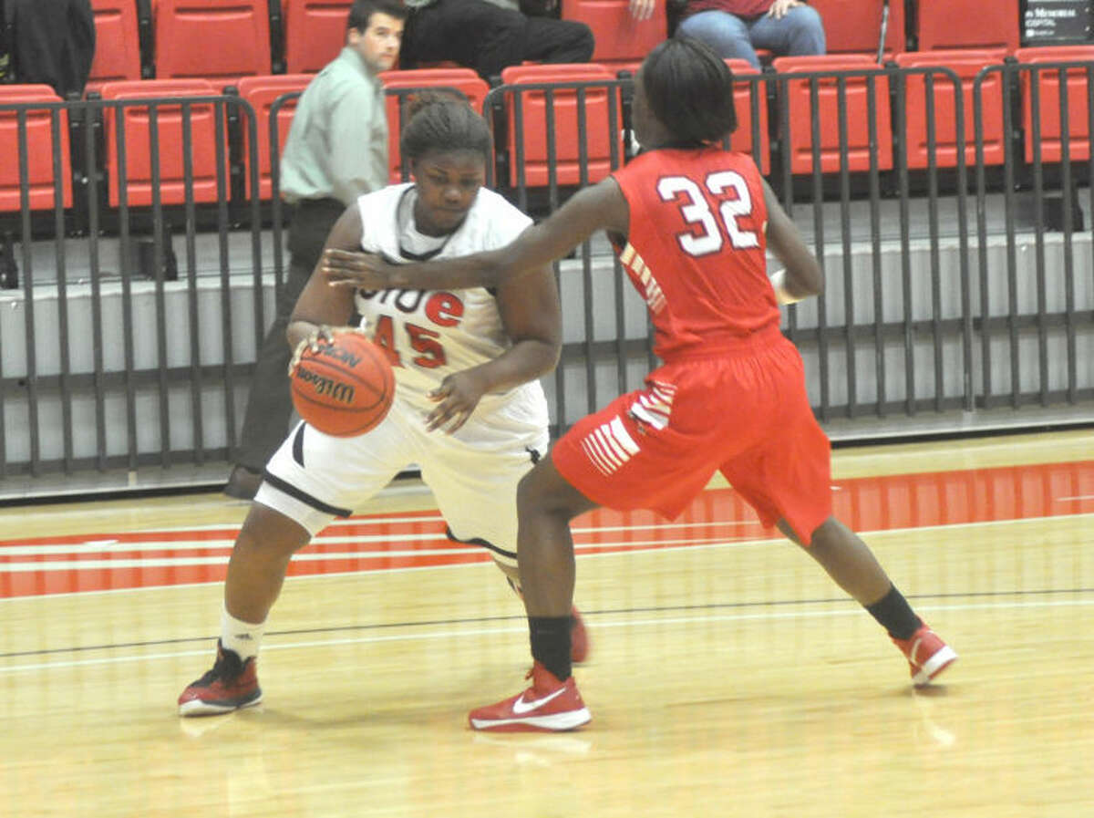SIUE’s Raven Berry looks to drive around a Southeast Missouri State defender on Monday at the Vadalabene Center.