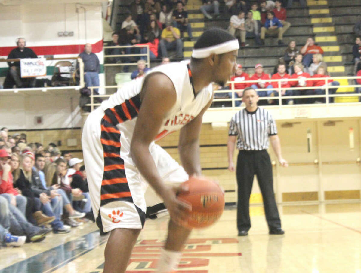 Edwardsville’s Darius Crochrell looks to move the basketball during the first half Friday in the semifinals of the Salem Invitational against Mount Vernon.  