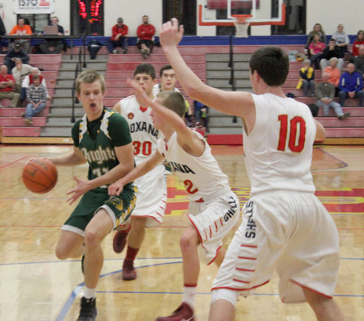 Metro-East Lutheran’s Paul Klarich drives past a Roxana defender during Tuesday's 55-48 win over the host Shells. 
