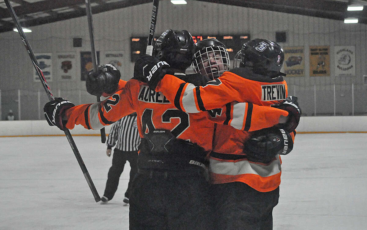 Edwardsville’s Jake Aurelio, left, and Christian Trevino, right, celebrate after Trevino scored to extend the lead to 3-0.