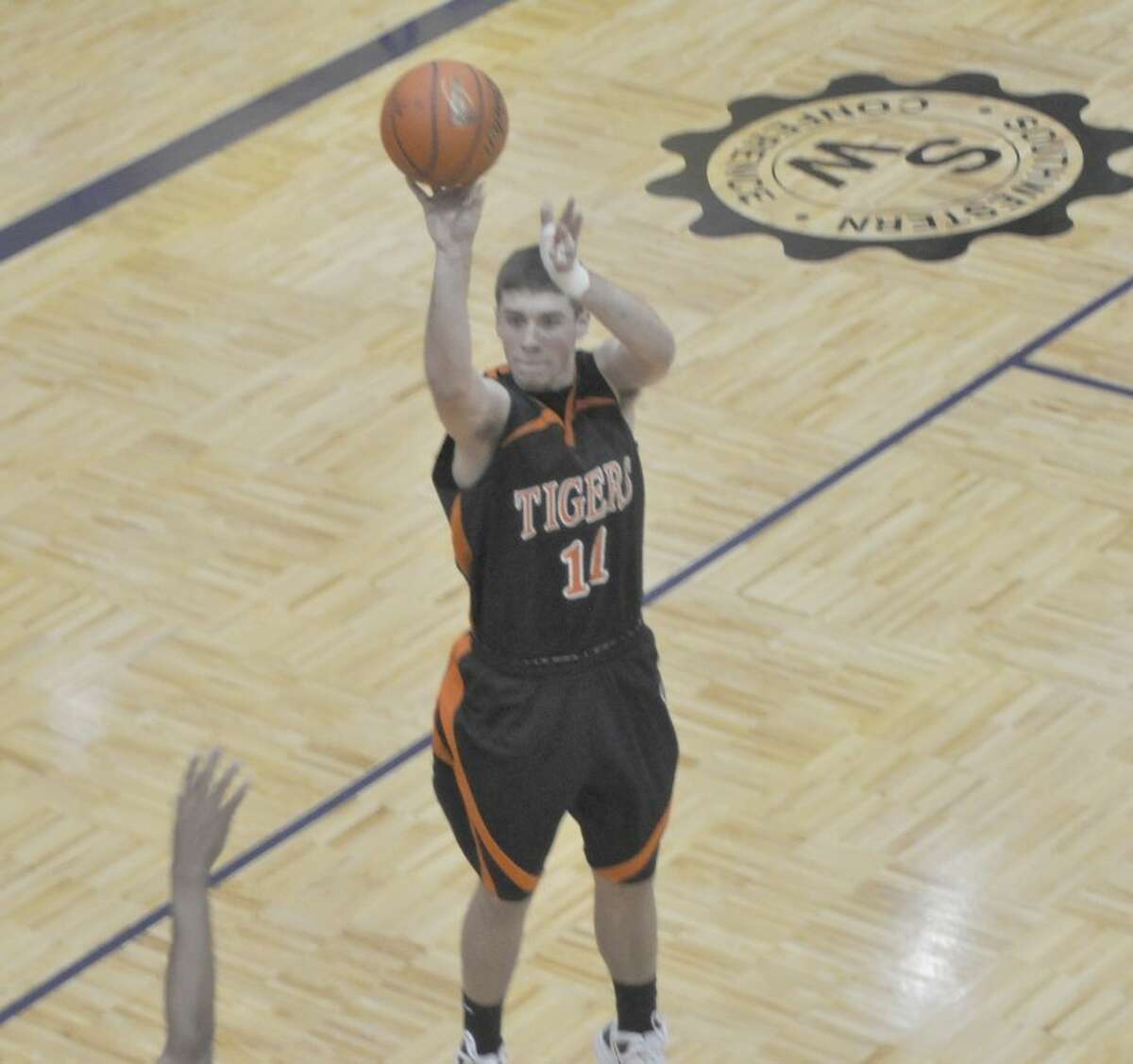 Tiger Drew Curtis releases a three-pointer.
