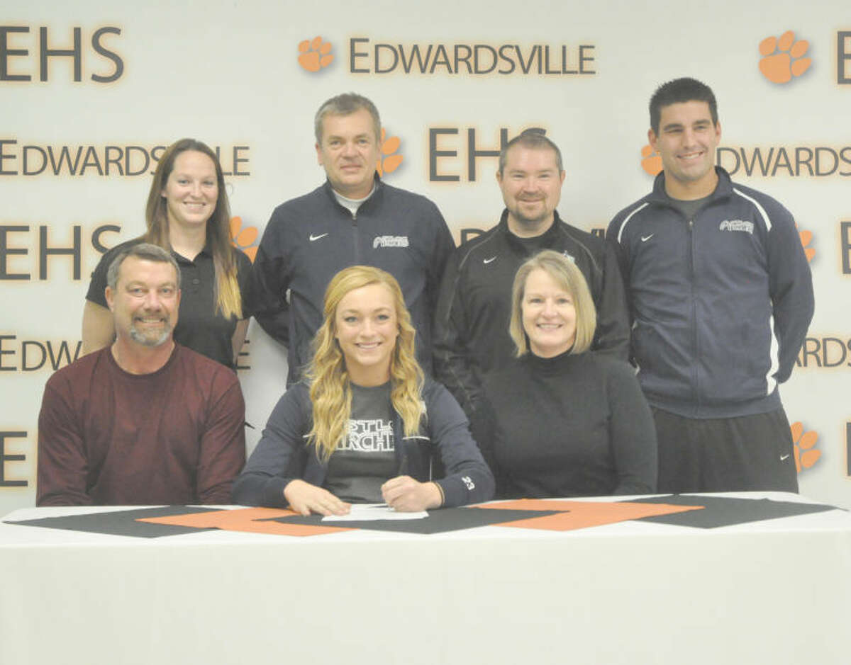 Edwardsville senior Taylor Tosovsky signed with Meramec Community College to continue her soccer career next fall. Sitting from left to right are Tim Tosovsky, father, Taylor and Sherry Tosovsky, mother. Standing from left to right are EHS girls’ soccer head coach Abby Bohnenstiehl, St. Louis Community College head coach Juergen Huettner, St. Louis Gallagher club coach Mitch Bohnak and STLCC assistant coach Alex McDonald.