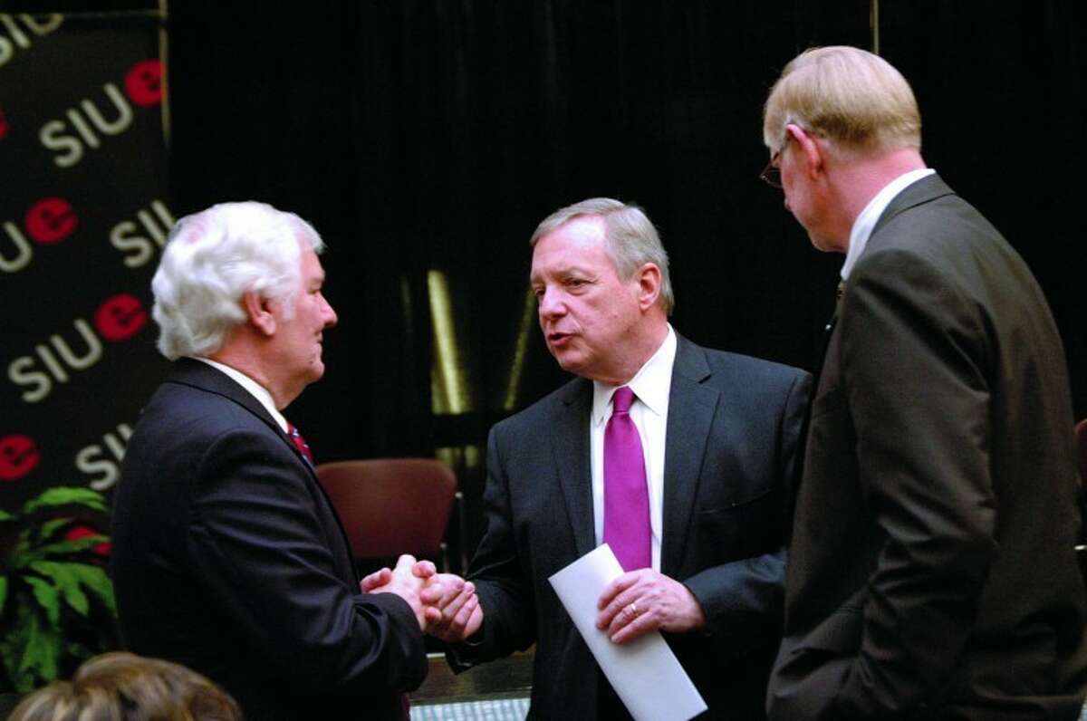 U.S. Sen. Dick Durbin, center, chats with Glenn Poshard, president of Southern Illinois University, before speaking Tuesday at a press conference on banking practices held at SIU's Edwardsville campus. Looking on at right is Vaughn Vandegrift, chancellor of SIUE. Poshard introduced Durbin and praised him for his support of energy development projects at SIUE and in southern Illinois.
