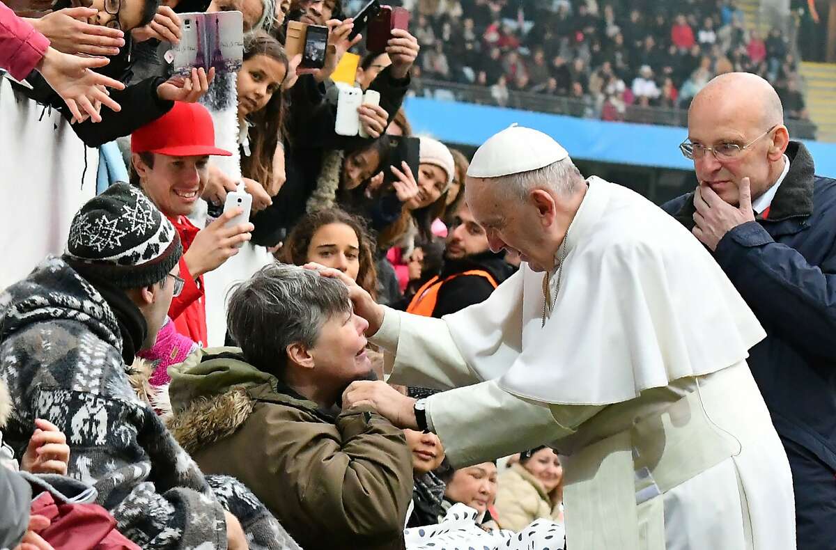 TOPSHOT - Pope Francis greets a handicapped wellwisher as he arrives at the Swedenbank Stadion in Malmo, Sweden, where he is to hold a mass on November 1, 2016. Francis is on a two-day visit to Sweden to mark the 500th anniversary of the Reformation -- a highly symbolic trip, given that Martin Luther's dissenting movement launched centuries of bitter and often bloody divisions in Europe. / AFP PHOTO / VINCENZO PINTO / ALTERNATIVE CROP VINCENZO PINTO/AFP/Getty Images