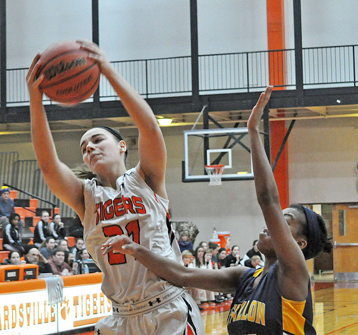EHS forward Rachel Pranger, left, is able to grab a rebound away from an O’Fallon defender early in the second quarter.