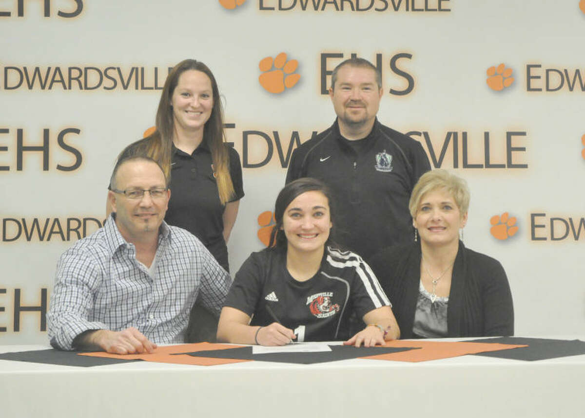 Left, Edwardsville senior Rachel Wiesehan signs to play soccer at Maryville University next season. Pictured seated from left to right are Kenny Wiesehan, father, Rachel and Jackie Wiesehan, mother. Standing are EHS girls’ soccer coach Abby Bohnenstiehl, left, and St. Louis Gallagher club coach Mitch Bohnak. 