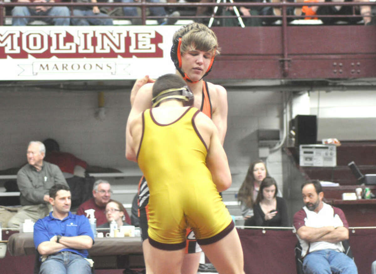 Tiger Haydon Grammer locks up with Lockport’s Dan Radcliffe in the third place match at 126 pounds on Saturday.