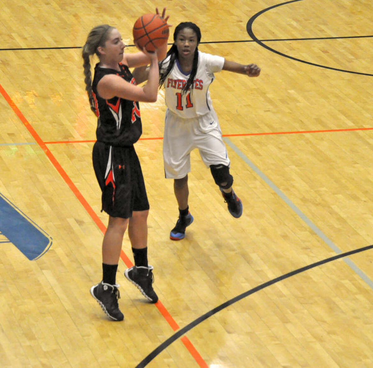 EHS’ Kennedy Martin attempts a 3-pointer on Thursday.