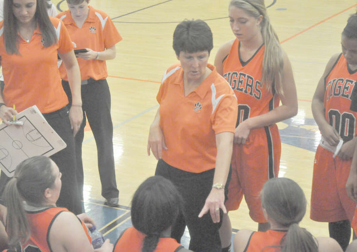 Edwardsville coach Lori Blade talks to her team during a timeout at East St. Louis on Dec. 18. EHS plays Richwoods in the Normal West Sectional title game tonight.