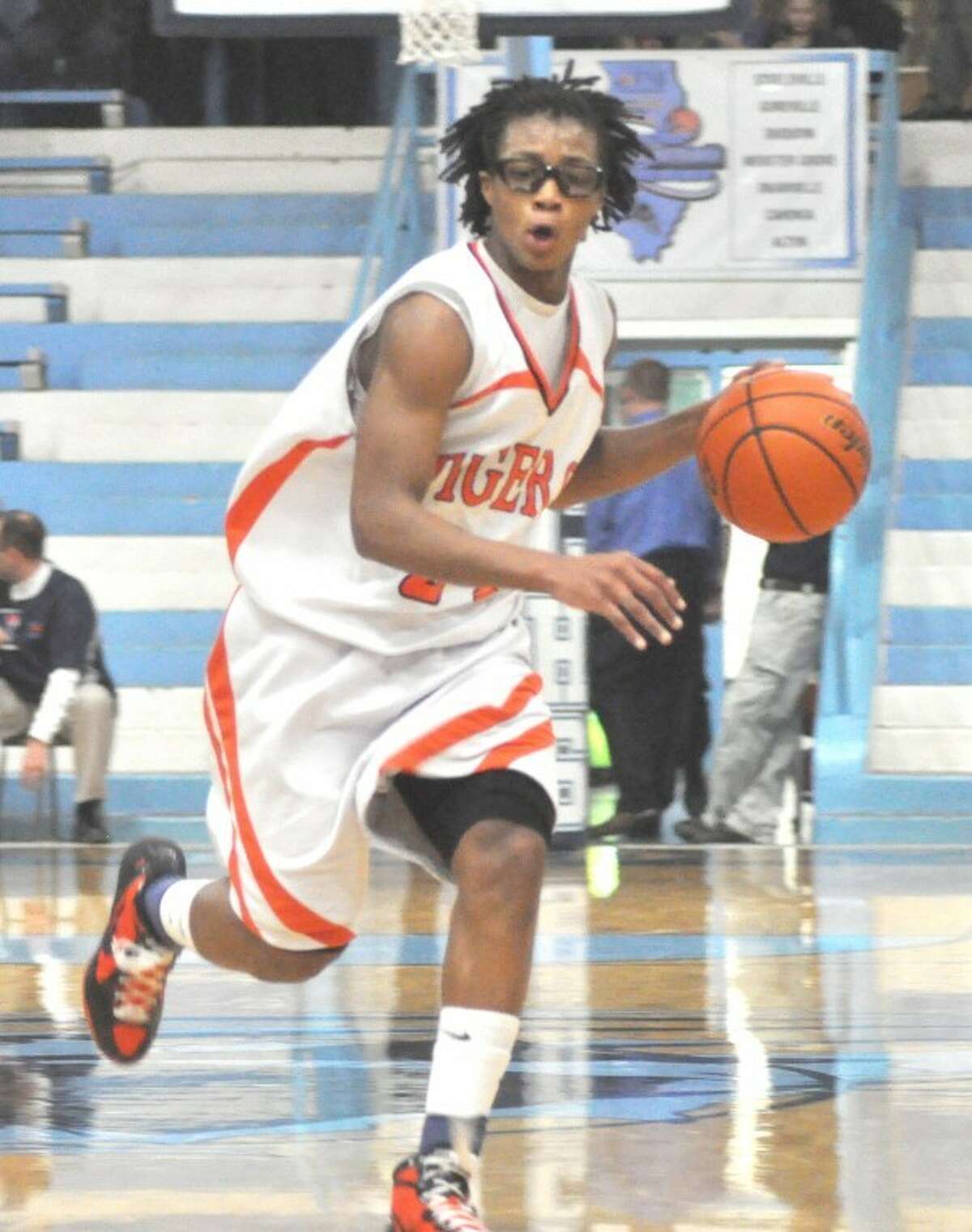 Tiger point guard Shawn Roundtree brings the ball up court Saturday in Pinckneyville against Webster Groves.