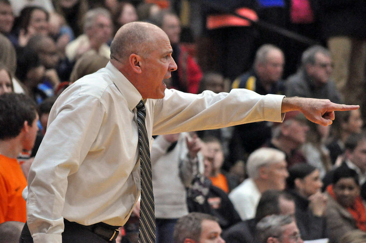 Edwardsville boys’ basketball coach Mike Waldo shouts out instructions to his defense during a game against O’Fallon on Jan. 9 at Lucco-Jackson Gymnasium.
