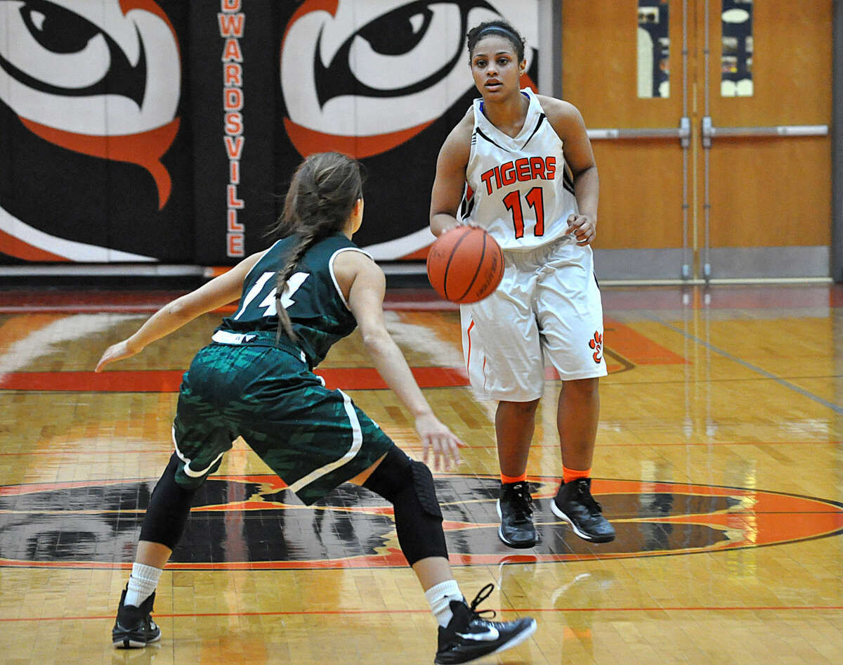 Edwardsville point guard Amayha Dycus, right, dribbles the ball up court with St. Joseph’s defender Amy Barton watching her on Wednesday at Lucco-Jackson Gymnasium.