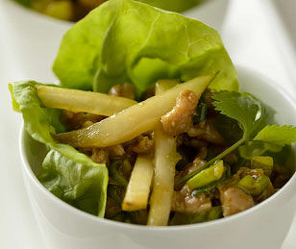 Fresh crisp pears give these savory chicken lettuce wraps a sweet flavor and crunch.