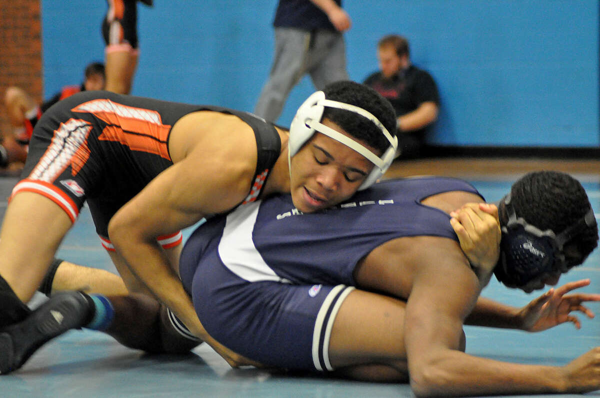Edwardsville’s Joe Griffen, top, competes with Belleville East’s Andrew Hambrick in the 132-pound match.