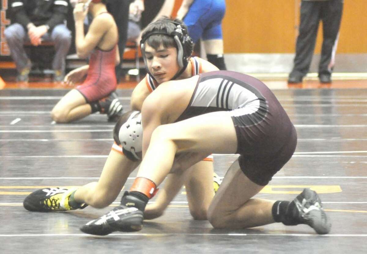 Edwardsville's Dalton Brito battles Belleville West's Nate Smalling in the regional finals at 113 pounds on Saturday at EHS. Brito lost the match, but is one of 12 Tigers who earned spots in the Class 3A Lincoln-Way Central Sectional on Friday and Saturday in New Lenox.