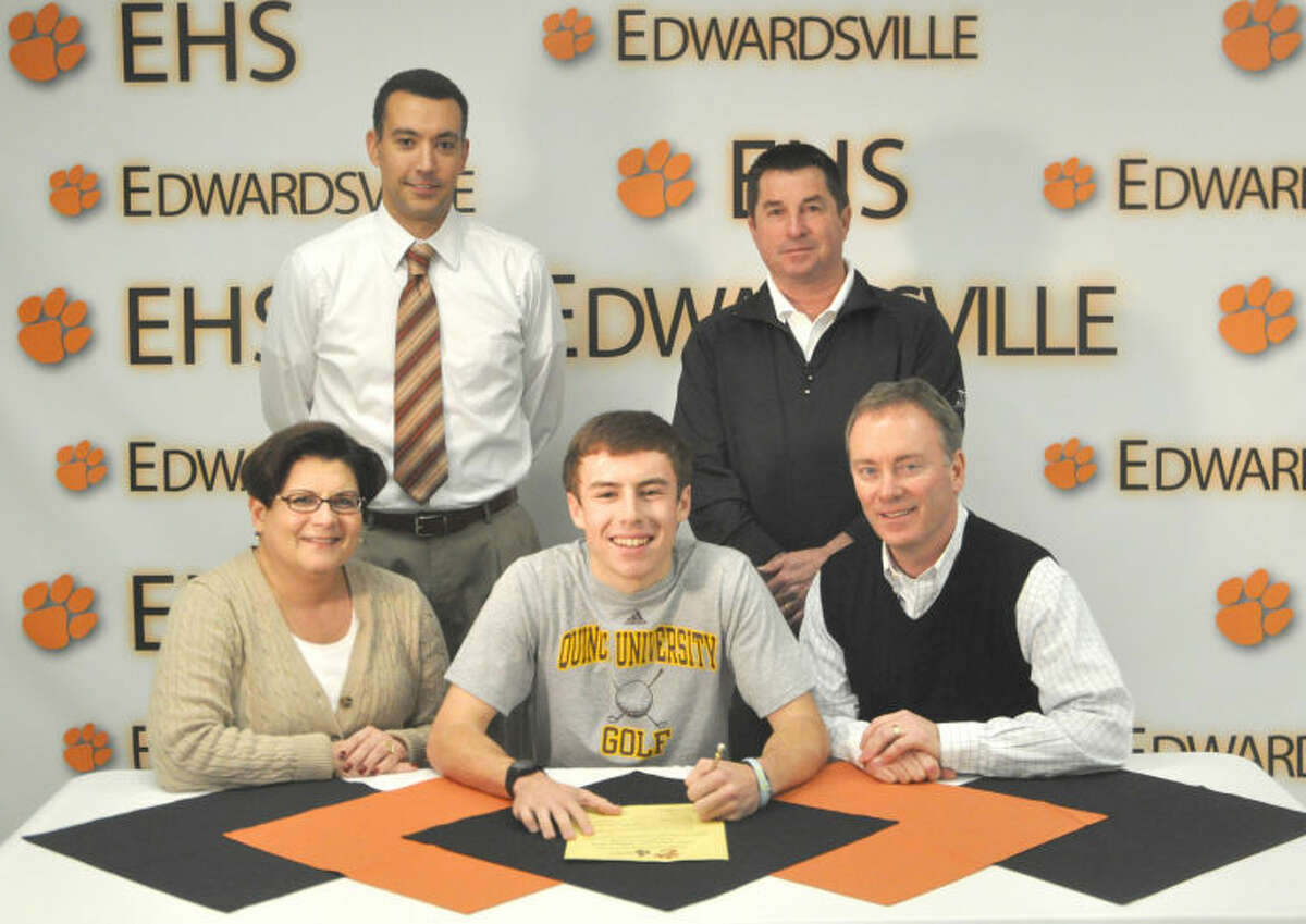 Edwardsville Tiger senior John Schmidtke recently signed a letter of intent to continue his golf career at Quincy University. Seated from left to right are: Kathy Childers, mother, Schmidtke and Tim Childers, father. Standing from left to right are: EHS head boys’ golf coach Dene Schickedanz and Jon DePriest, PGA Director of Golf at Sunset Hills Country Club.