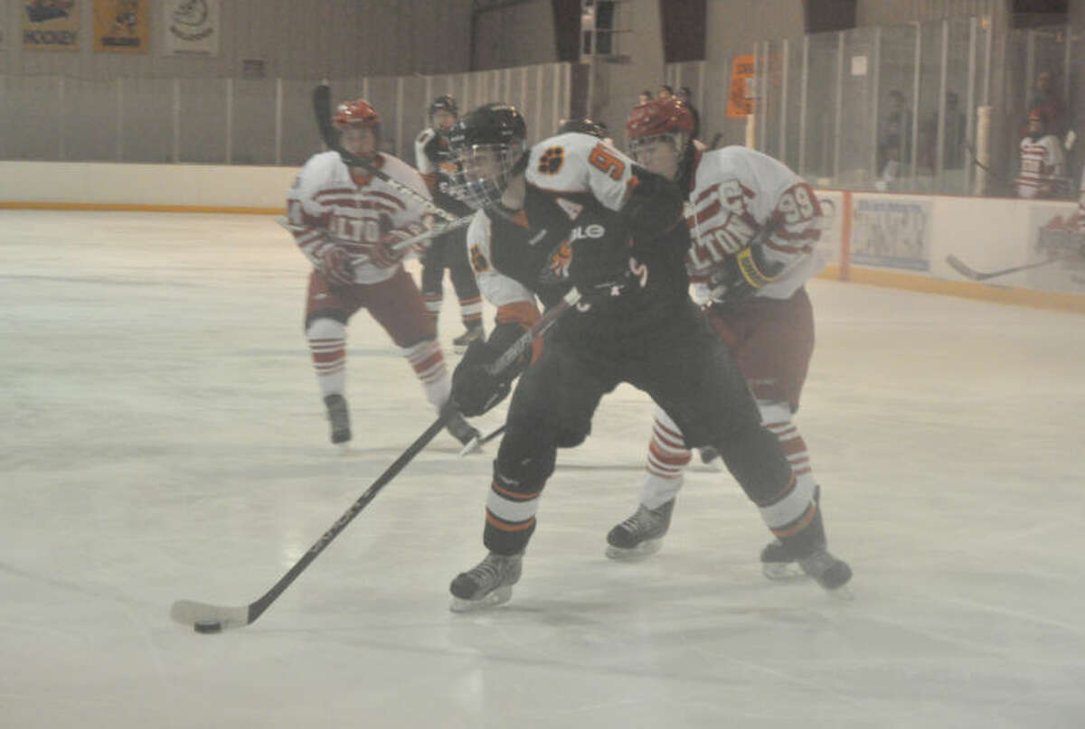 Edwardsville senior Jon Weisner skates in to score the first goal of the game against the Redbirds on Tuesday at the East Alton Ice Arena.  