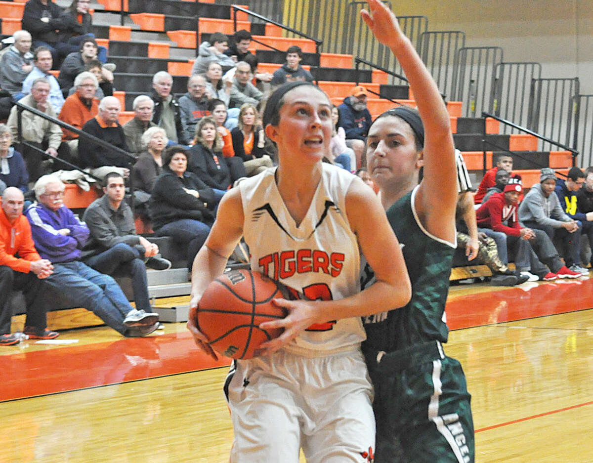 Edwardsville sophomore Makenzie Silvey drives to the basket past a St. Joseph’s Academy defender on Wednesday at Lucco-Jackson Gymnasium.