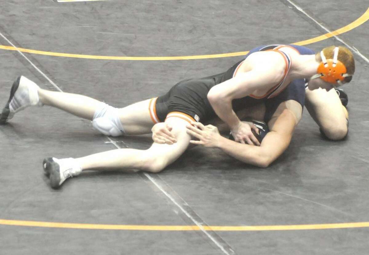 Edwardsville's Will Velez takes control against Belleville East's Kyzen Smith Saturday during semifinal action at 170 pounds in the Class 3A Edwardsville Regional.