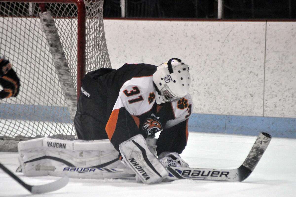 Edwardsville goalie Matthew Griffin covers up the puck Thursday during Game 2 of the MVCHA 1A East Division finals at Granite City.
