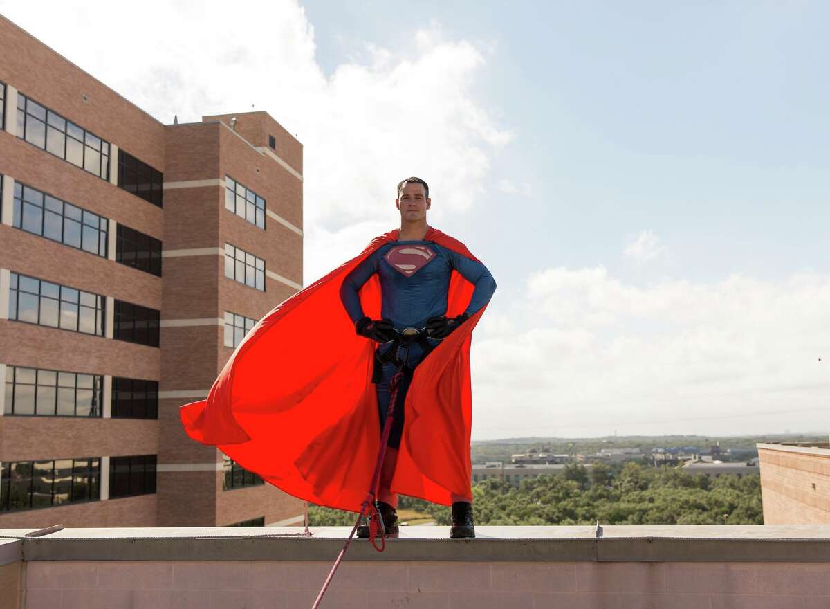 Members of the San Antonio Fire Department and the San Antonio Police Department's SWAT unit participated in the third-annual "Superhero Drop," in honor of a 5-year-old boy who lost his battle with cancer in 2015.