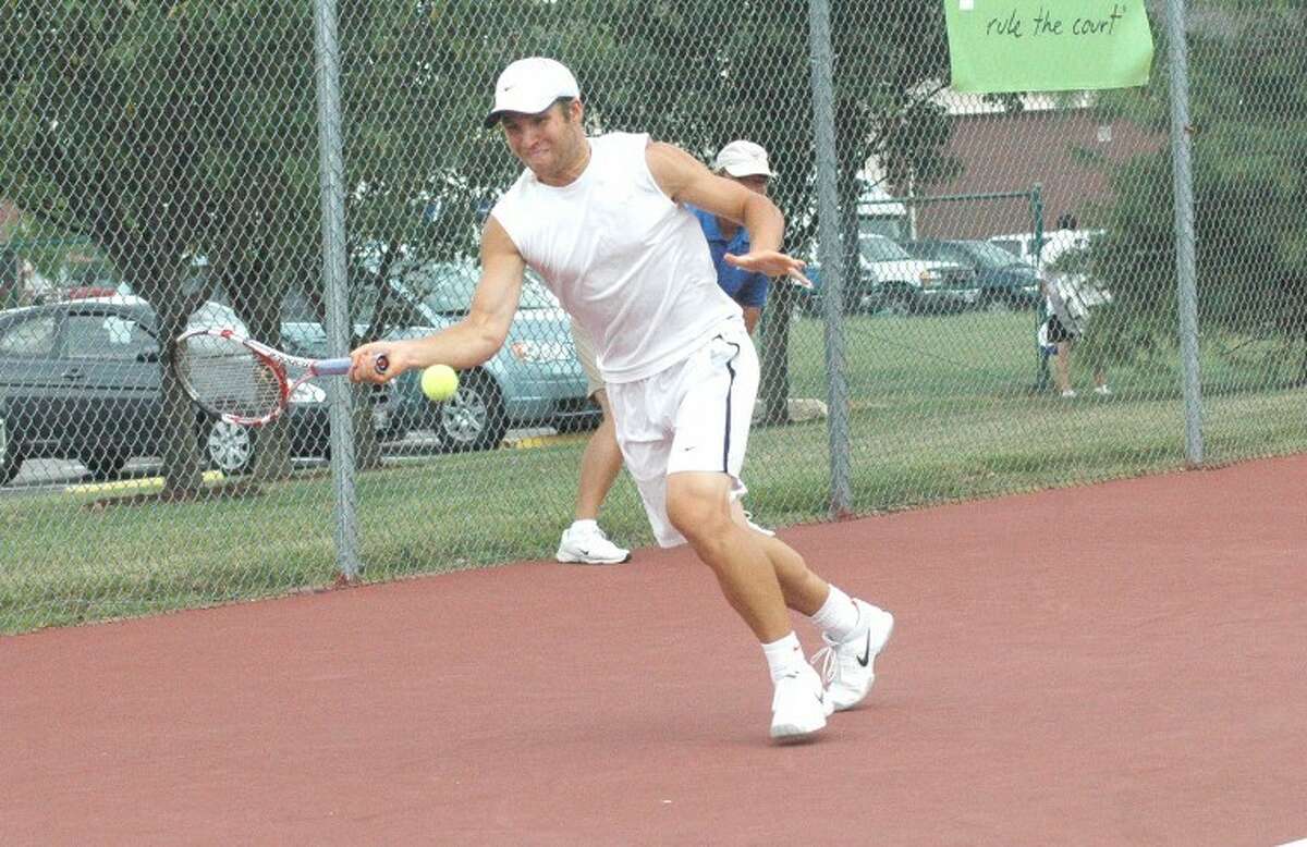 University of Illinois tennis player Roy Kalmanovich hits a forehand on Wednesday at the EHS Tennis Center during his upset win over No. 1 seed Clement Reix in the Edwardsville Futures Touranment.