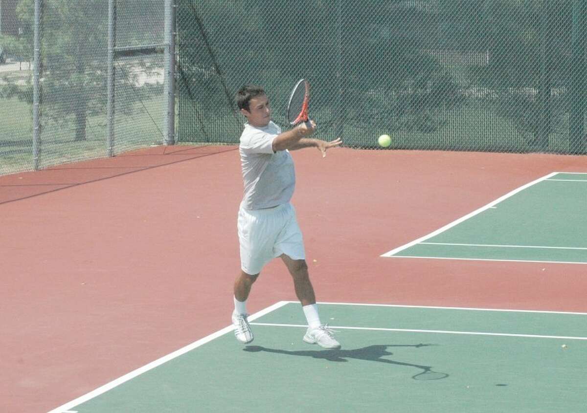 Mousheg Hovhannisyan returns a shot against Chase Buchanan in the quarterfinals of the Edwardsville Futures Tournament at the EHS Tennis Center on Friday. Hovhannisyan won in three sets.