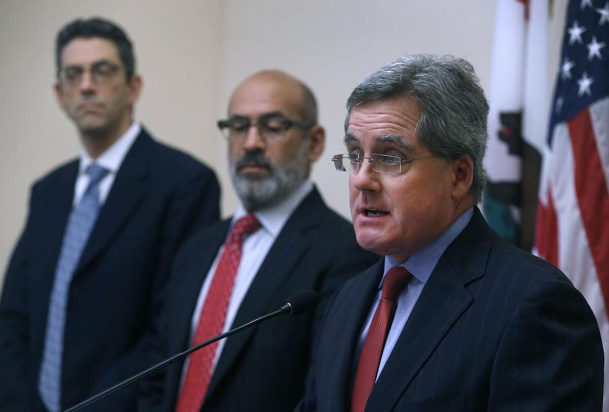 City Attorney Dennis Herrera announces at a City Hall news conference that the state's bail schedule is unconstitutional and won't defend it in a lawsuit filed against the sheriff's department in San Francisco, Calif. on Tuesday, Nov. 1, 2016. Standing with Herrera is deputy city attorney Jeremy Goldman (left) and chief deputy Ronald Flynn.