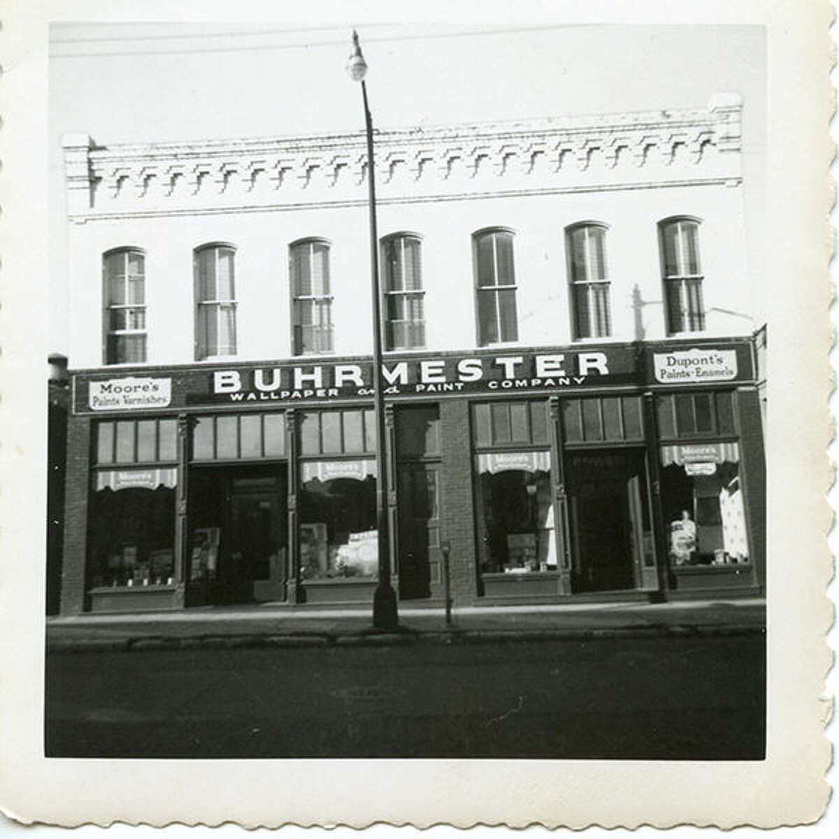 When their sign was damaged in a 2010 storm, this original Buhrmester sign was uncovered and restored. It is seen here in the 1950s.