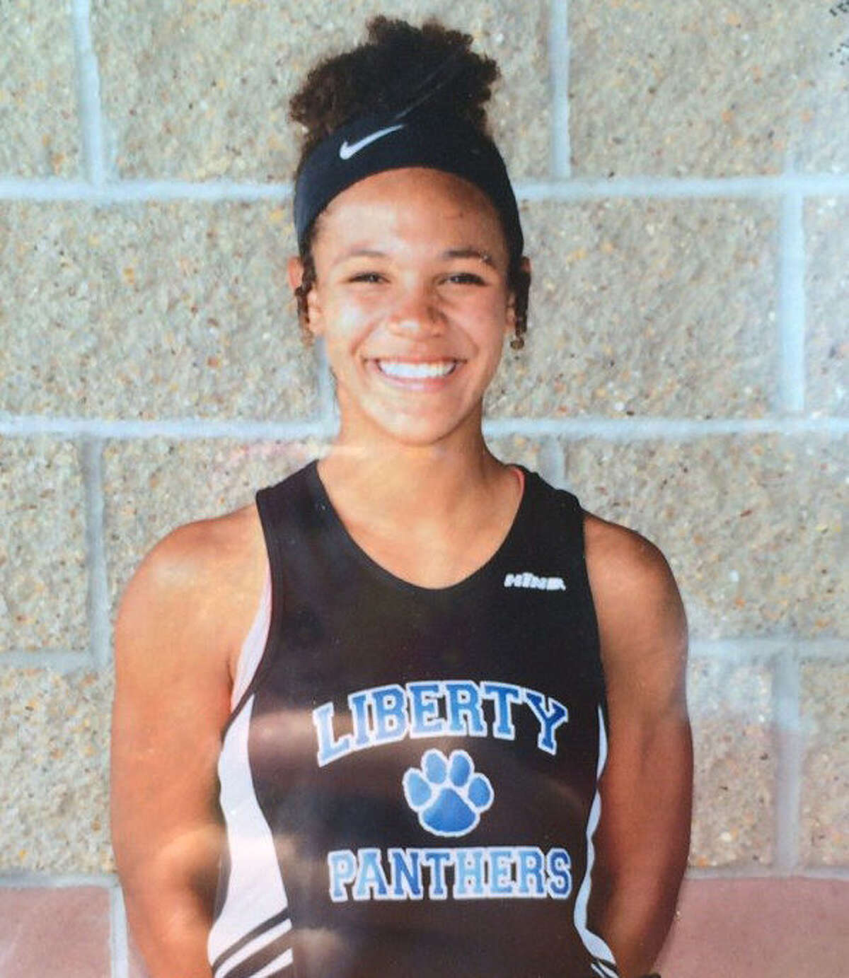 GIRLS' TRACK AND FIELD Liberty’s Smith is shot put champ